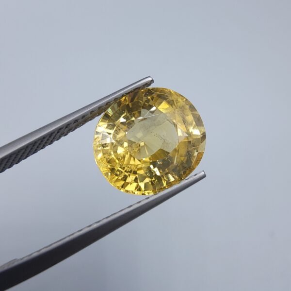 Natural Yellow Sapphire - 6.19 Ct, AIG Certified, Oval Cut from Srilanka