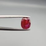 A 0.98 carat natural red Ruby (Yaqoot) from Kabul, Afghanistan, showing both front and back views to display its oval cut, rich saturation, and natural internal characteristics.