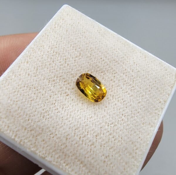 0.46 carat natural yellow sapphire gemstone (Pukhraj), oval shape/cut, sourced from Madagascar. Available for sale in Karachi, Pakistan.