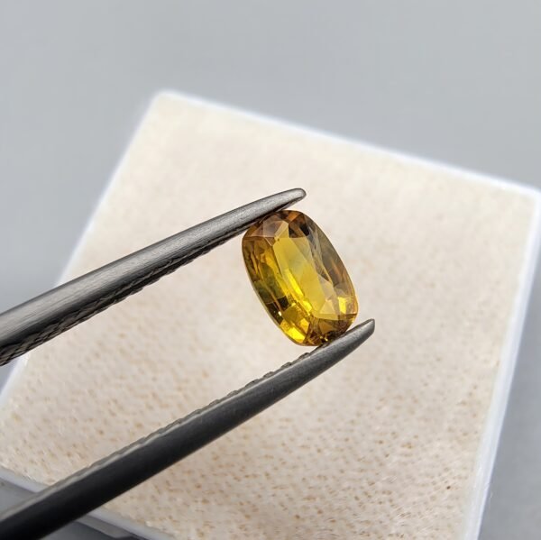 0.46 carat natural yellow sapphire gemstone (Pukhraj), oval shape/cut, sourced from Madagascar. Available for sale in Karachi, Pakistan.