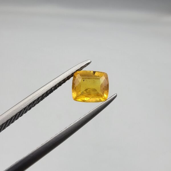 0.81 carat natural yellow sapphire gemstone (Pukhraj), cushion shape/cut, sourced from Madagascar. Available for sale in Karachi, Pakistan.