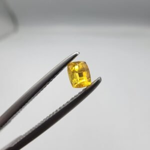 0.25 carat natural yellow sapphire gemstone (Pukhraj), square/cushion cut, sourced from Madagascar. Available for sale in Karachi, Pakistan.