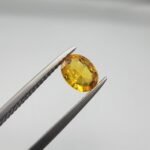 0.73 carat natural yellow sapphire gemstone (Pukhraj), square/cushion cut, sourced from Madagascar. Available for sale in Karachi, Pakistan.
