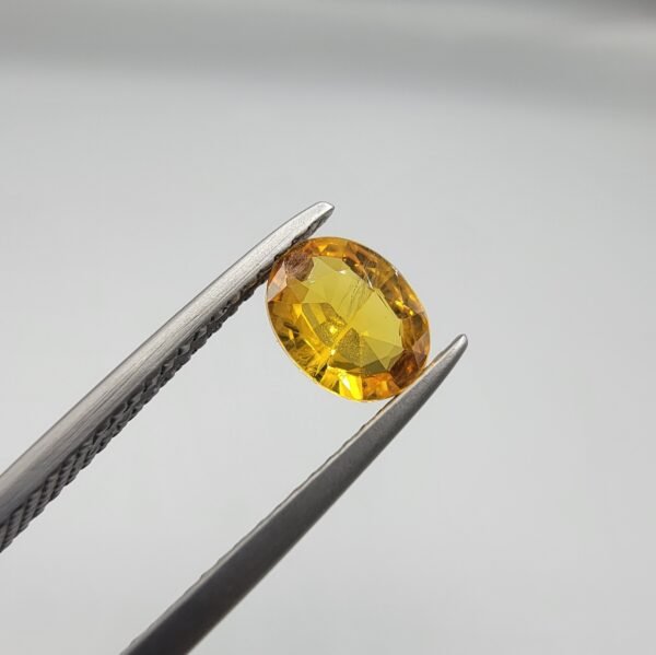 0.73 carat natural yellow sapphire gemstone (Pukhraj), square/cushion cut, sourced from Madagascar. Available for sale in Karachi, Pakistan.