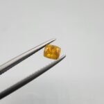 0.64 carat natural yellow sapphire gemstone (Pukhraj), square/cushion cut, sourced from Madagascar. Available for sale in Karachi, Pakistan.