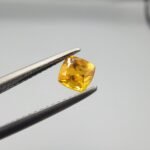 0.56 carat natural yellow sapphire gemstone (Pukhraj), square/cushion cut, sourced from Madagascar. Available for sale in Karachi, Pakistan.