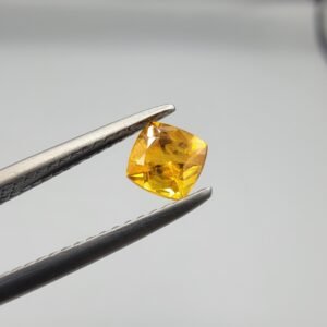 0.56 carat natural yellow sapphire gemstone (Pukhraj), square/cushion cut, sourced from Madagascar. Available for sale in Karachi, Pakistan.