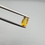 0.47 carat natural yellow sapphire gemstone (Pukhraj), oval cut, sourced from Madagascar. Available for sale in Karachi, Pakistan.