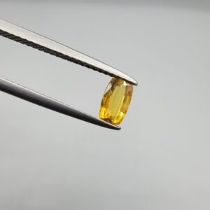 0.47 carat natural yellow sapphire gemstone (Pukhraj), oval cut, sourced from Madagascar. Available for sale in Karachi, Pakistan.