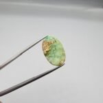 7.71 carat natural green Hussaini Feroza gemstone, oval cabochon cut, with matrix pattern, sourced from Neyshabur, Iran. Available for sale in Karachi, Pakistan.