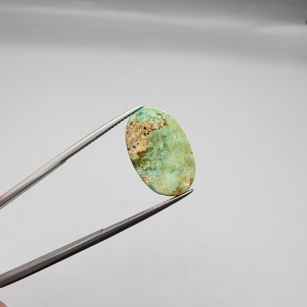 7.71 carat natural green Hussaini Feroza gemstone, oval cabochon cut, with matrix pattern, sourced from Neyshabur, Iran. Available for sale in Karachi, Pakistan.