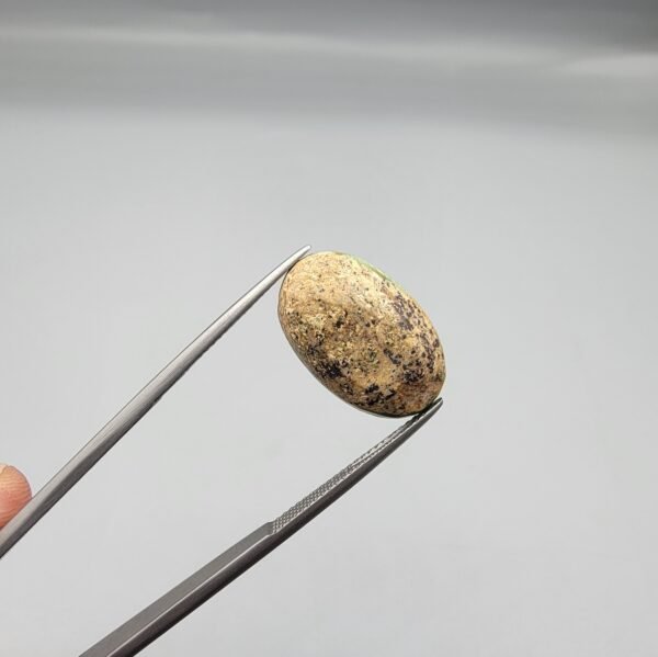 7.71 carat natural green Hussaini Feroza gemstone, oval cabochon cut, with matrix pattern, sourced from Neyshabur, Iran. Available for sale in Karachi, Pakistan.