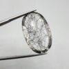 Natural rutilated quartz (Moh-E-Najaf) gemstone, 34 carat weight, oval cut, Iraq origin (Najaf), clear with black rutile inclusions.