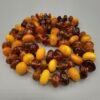 Natural Baltic Amber string featuring mixed yellow German amber beads and brown Russian amber beads, polished and naturally translucent, total weight 54 grams.