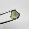 Natural rutilated peridot zabarjad 4.65 carat gemstone from Kohistan Valley Pakistan with visible rutile inclusions