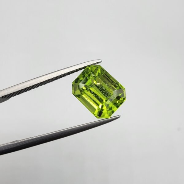 Natural rutilated peridot zabarjad 4.52 carat emerald cut from Kohistan Valley Pakistan with bright green color and visible natural inclusions