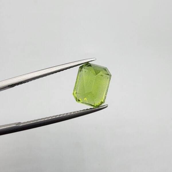Natural rutilated peridot zabarjad 4.52 carat emerald cut from Kohistan Valley Pakistan with bright green color and visible natural inclusions