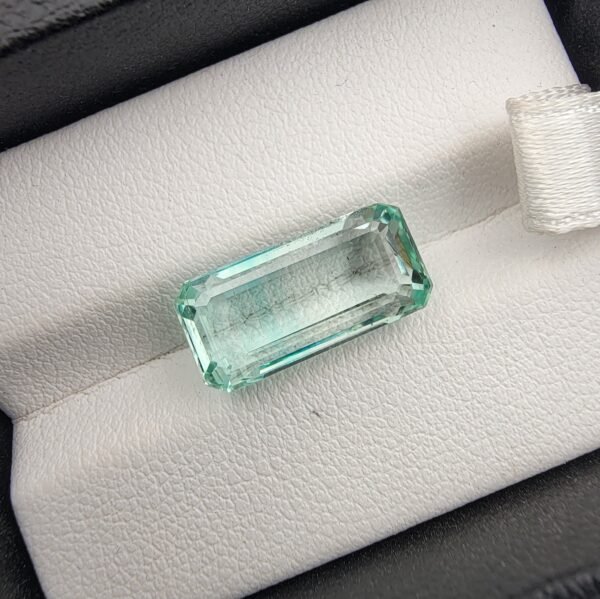 Rare 7.28 carat natural green emerald gemstone from Panjshir Valley, Afghanistan, featuring exceptional clarity and vibrant neon green hue.