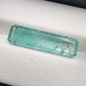 Rare 7.62 carat natural green emerald gemstone from Panjshir Valley, Afghanistan, featuring exceptional crystalline transparency and vivid neon-green color.