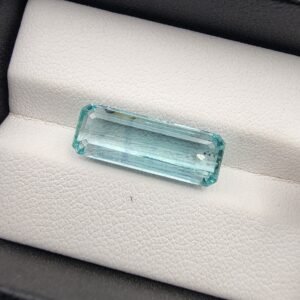 Rare 7.46 carat natural green emerald gemstone from Panjshir Valley, Afghanistan, featuring exceptional crystalline transparency and a vibrant neon-green hue.