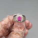 Natural 2.00 carat purplish-red ruby from Afghanistan, set in a premium men's silver ring with a mixed oval cut and semi-transparent clarity.