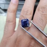 Rare 7.75 carat natural blue sapphire gemstone from Afghanistan, featuring a deep saturated blue hue and exceptional crystalline structure.