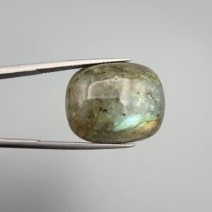 Large 32.36 carat natural labradorite gemstone displaying intense labradorescence with electric blue and golden-green flashes across a high-polish oval surface.