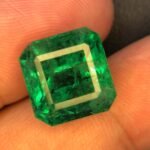 GFCO certificate of natural emerald 10.64 carat vivid green octagon step cut gemstone from Zambia