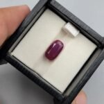 Rare 5.32 carat natural red ruby gemstone from Mozambique, featuring an oval cut with exceptional crystalline transparency and vivid saturation.