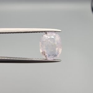 Certified 2.55 carat natural unheated sapphire from Sri Lanka (Ceylon), featuring a high-clarity crystal structure and vibrant natural color, shown in a professional gemstone display.