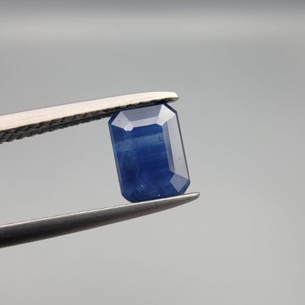 Certified 1.09 carat natural blue sapphire (Neelam) from Sri Lanka, featuring a sophisticated emerald and step cut with high-clarity crystal structure and no heat treatment.