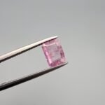 Rare 1.49 carat natural purplish pink sapphire from Sri Lanka, featuring a sophisticated emerald and step cut with high-clarity crystal structure and no heat treatment.