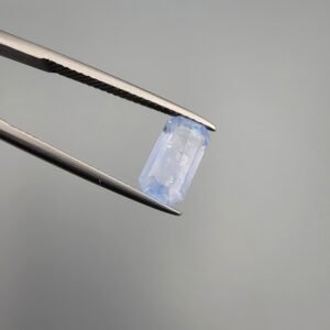 Exquisite 2.54 carat natural unheated blue sapphire (Neelam) from Sri Lanka, featuring rare "Rainbow Sparks" rainbow-like inclusions on the surface and high-grade transparency in an emerald step cut.