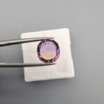 High-clarity 4.38 carat natural ametrine gemstone from Brazil, featuring a perfect color split between purple amethyst and golden citrine in a brilliant round or oval faceted cut.