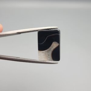 High-polished 5.22 carat natural Black Agate (Sulemani Aqeeq) rectangular cabochon featuring a crisp white parallel "banded" or "stratified" formation across a deep black background.