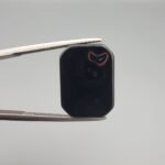 High-polished 7.17 carat natural Black Agate (Sulemani Aqeeq) rectangular cabochon featuring a unique natural white "bunny ears" formation on one side and a distinct "eye" formation on the reverse.