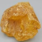 Massive 1,268.05 carat raw natural copal specimen, often known as "Young Amber," featuring a rich honey-gold translucent body with organic surface textures.