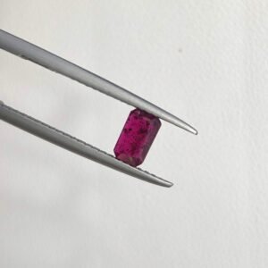 Precision meets passion. This 0.62-carat natural ruby features a sophisticated emerald step cut, making it a perfect center stone for a minimalist band or a delicate pendant.