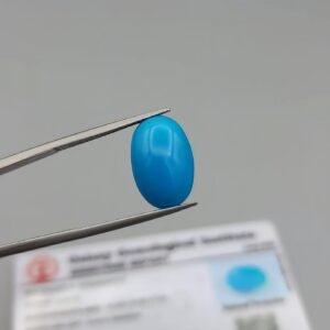 GGI certified 9.03 carat natural Arizona turquoise (Feroza) featuring a vibrant sky-blue color and a perfectly polished oval cabochon cut.