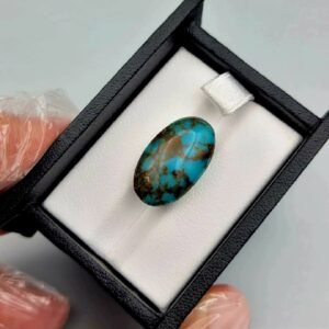 Significant 15.29 carat natural Egyptian turquoise (Feroza) oval cabochon with a rich teal-blue body and an extensive, earthy brown spiderweb matrix.