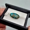 Significant 15.29 carat natural Egyptian turquoise (Feroza) oval cabochon with a rich teal-blue body and an extensive, earthy brown spiderweb matrix.