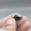 Significant 18.03 carat natural Egyptian turquoise (Feroza) oval cabochon featuring a vibrant sky-blue body with large, bold dark brown matrix "island" clusters.