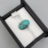 Vibrant 7.04 carat natural Egyptian turquoise (Feroza) oval cabochon displaying a luminous sky-blue surface with a delicate, fine dark-brown spiderweb matrix.