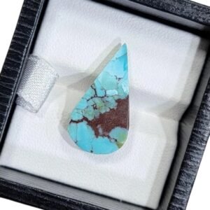 Vibrant 5.60 carat natural Egyptian turquoise (Feroza) pear cabochon displaying a bright sky-blue surface with a dense, dark chocolate-brown iron stone matrix.