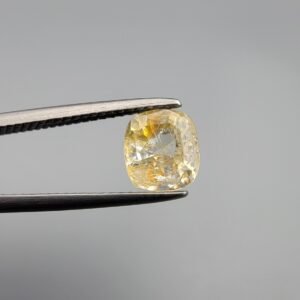 ​A 1.76 carat natural yellow sapphire (Pukhraj) from Sri Lanka, featuring a classic cushion cut and a clear, sun-bright yellow hue.