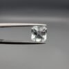 ​A 2.15-carat natural Shigar Valley Aquamarine (Beruj) gemstone with an octagon emerald cut, featuring clear sky-blue color and beautiful natural inclusions, held in jeweler's tweezers.