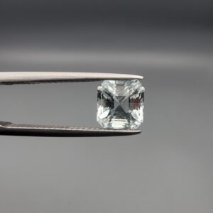 ​A 2.15-carat natural Shigar Valley Aquamarine (Beruj) gemstone with an octagon emerald cut, featuring clear sky-blue color and beautiful natural inclusions, held in jeweler's tweezers.