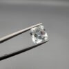 ​A 2.15-carat natural Shigar Valley Aquamarine (Beruj) gemstone with an octagon emerald cut, featuring clear sky-blue color and beautiful natural inclusions, held in jeweler's tweezers.