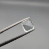 ​A 2.15-carat natural Shigar Valley Aquamarine (Beruj) gemstone with an octagon emerald cut, featuring clear sky-blue color and beautiful natural inclusions, held in jeweler's tweezers.