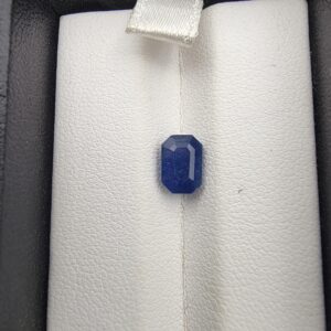 A 1.92-carat natural Ceylon Blue Sapphire featuring a vivid blue color and an octagon faceted cut, presented in a white jeweler's box.